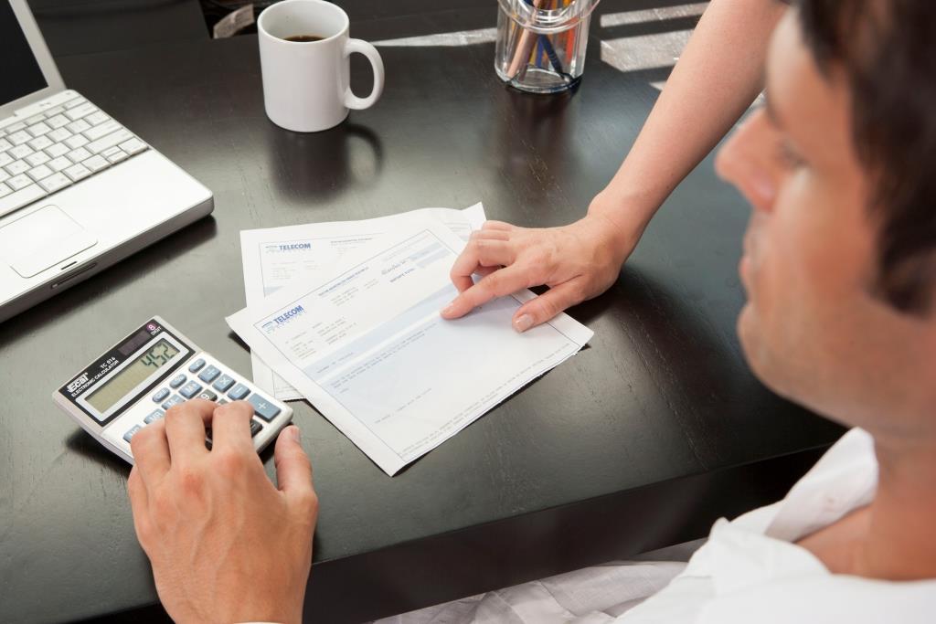 Hispanic couple managing finances